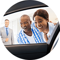 Man and Woman looking into the car through an open window 
